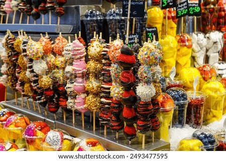 Similar – Image, Stock Photo A fresh strawberry skewered with a fork