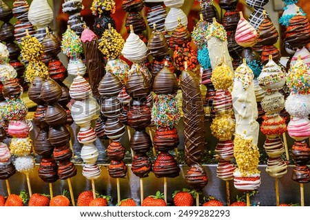 Similar – Image, Stock Photo A fresh strawberry skewered with a fork