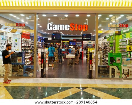 ROME, ITALY - JUNE 21, 2015. GameStop Store in Rome, Italy with people shopping. GameStop is an American video game, consumer electronics and wireless services retailer.