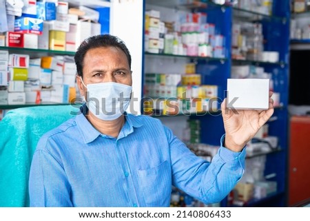 Similar – Image, Stock Photo Pharmacist holding medicine box in pharmacy drugstore.