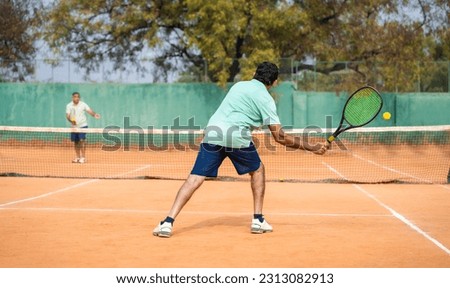 Similar – Image, Stock Photo Senior man playing tennis in gym