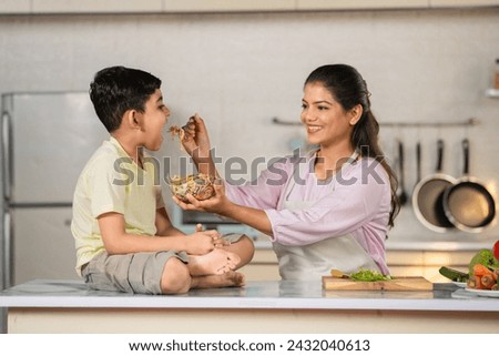 Similar – Image, Stock Photo Mother feeding Son with yoghurt at home
