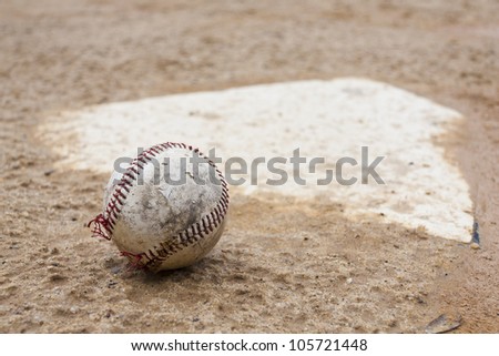 Old baseball and baseball base.