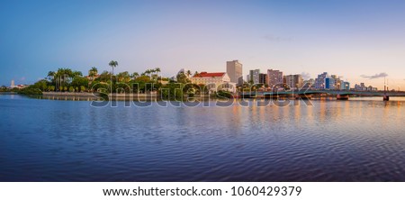 The skyline of the historic city of Recife in Pernambuco, Brazil by the Capibaribe river at sunset. Foto stock © 