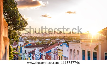 The colonial buildings of Olinda contrasting with the contemporary ones of Recife in Pernambuco, Brazil at sunset. Foto stock © 
