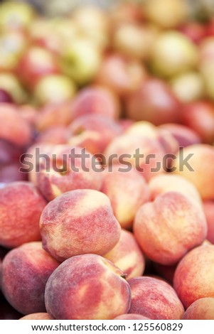 Very nice pile of ripe and juicy peaches.