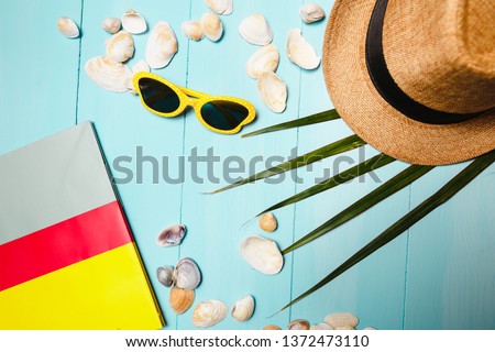Yellow sunglasses and hat on blue background and other accessories. I'm ready to travel in the summer. Stok fotoğraf © 