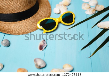 Yellow sunglasses and hat on blue background and other accessories. I'm ready to travel in the summer. Stok fotoğraf © 