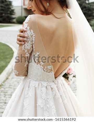 Similar – Image, Stock Photo Bride shows her beautiful lace wedding garter.