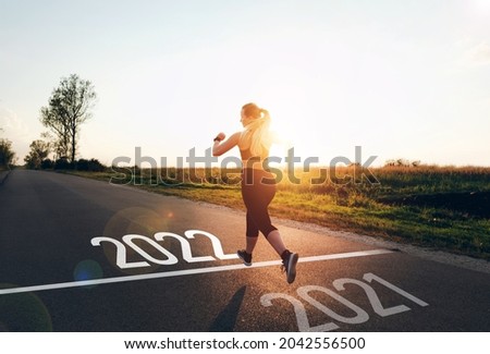 Similar – Image, Stock Photo Girl running towards the sea on the beach of the Baltic Sea with a yellow swimming ring on her back
