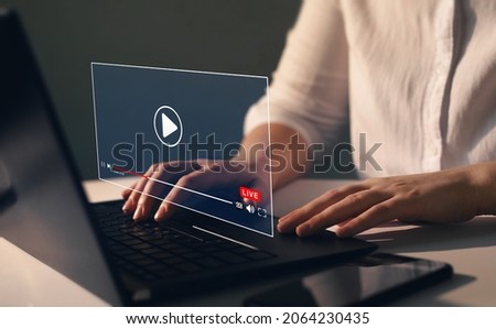 Businesswoman watching a
live stream.Online live stream window. Video streaming on internet concept. Live digital stream multimedia player.