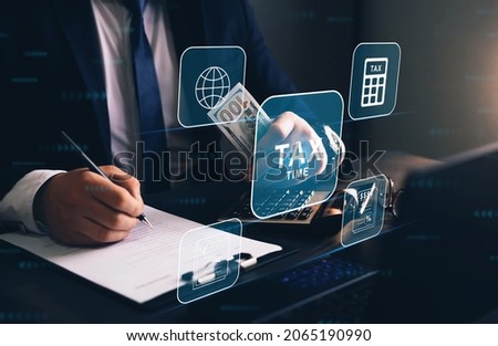 Businessman using the laptop to fill in the income  tax online return form for payment. Financial research,government taxes and calculation tax return concept. Tax Time