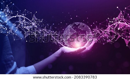 Metaverse Technology.Next generation technology.Global networking connection,science, innovation and communication technology.Hand holding earth globe with data exchanges on connection technology.
