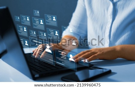 HR(human resources) technology.Online and modern technologies for simplifying the human resources system.Human resource manager checks the CV online to choose the perfect employee for his business. Stockfoto © 