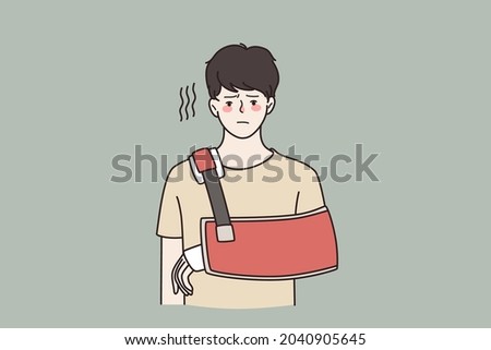 Injury and physical problem concept. Young sad frustrated man cartoon character standing with injured arm feeling unhappy vector illustration 