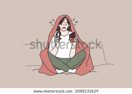 Unhappy young woman sit on sofa in blanket cry after breakup eat chocolate. Upset lonely girl feel desperate broken at home, have guilty pleasure sweets. Female life problem. Vector illustration.  Foto stock © 