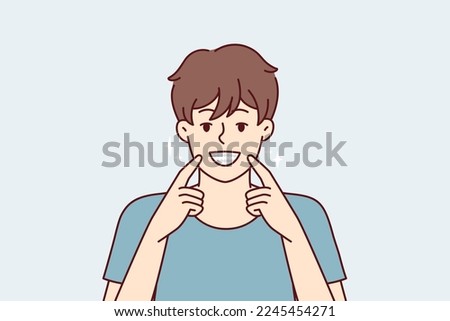 Man smiles broadly and shows off snow-white healthy teeth after going to dentist. Happy guy pointing fingers at mouth recommends good toothpaste for beaming smile. Flat vector illustration