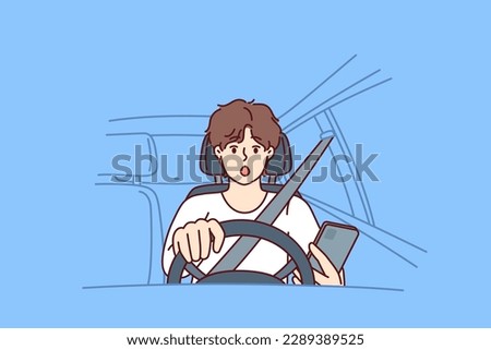 Distracted man driver with phone sits behind wheel of car and gets scared sees obstacle on road or sharp turn. Shocked driver not following traffic rules using smartphone while driving 