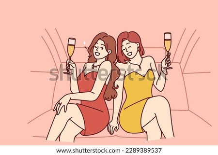 Celebrity women sit in luxury car with glasses filled with sparkling wine during pre-wedding bachelorette party. Celebrity girls in evening dresses riding in limousine enjoy premium atmosphere 