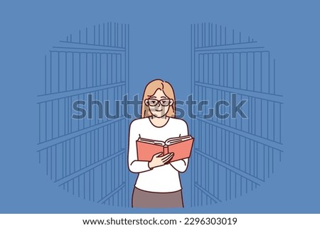 Woman is reading book in library, standing among shelves with textbooks and looking for right encyclopedia. Girl with book works as librarian or is visitor to bookstore and is fond of secondhand books