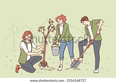 Volunteers plant trees in park and water seedlings to save nature from co2 emissions and climate change. People with paw and bucket for planting trees helping ecology recover after deforestation