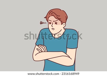 Angry man with hands folded in front of chest demonstrates envy and indignation after deceived expectations. Funny guy with indignation shows dissatisfaction due to bad customer experience