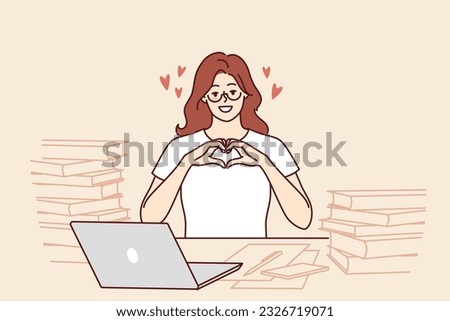 Romantic woman freelancer shows heart with fingers as token of appreciation to clients or employers. Girl in love says hello to boyfriend posing for romantic message at table with papers