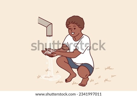 African boy sits near clean water faucet, rejoicing at opportunity to quench thirst during drought. Child drinks and draws water in palm of hand to drink, for concept acosania helping children Africa