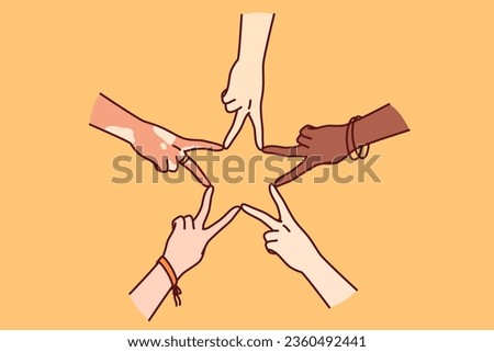 Hands of multiracial people making star shape from fingers, for concept tolerance and non-discrimination. Hands of different people together showing gesture of solidarity and peace