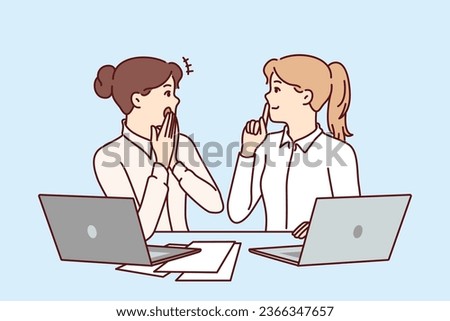 Woman office workers gossip and share secret forbidden for distribution, sitting at table with laptops and papers. Girls gossip and make shh sign forbidding data dissemination due to NDA contract