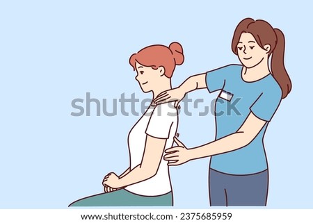 Woman physiotherapist gives massage to patient to relieve shoulder or back pain after failed workout. Girl works as physiotherapist and is engaged in chiropractic and helping people with sick spine