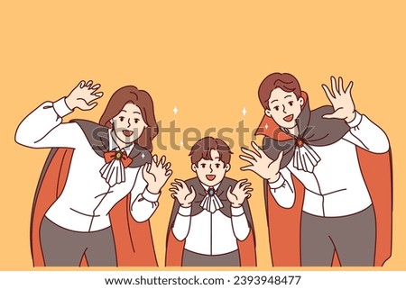 Family dressed as vampires to celebrate halloween shows fangs and rejoices at arrival of october 31st. Husband and wife with son in festive dracula family costumes for halloween party