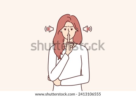 Frowning woman makes tss gesture calling for phones to be turned off or to speak more quietly. Girl orders silence, showing tss sign with hand, to calm down hyperactive children making lot of noise.