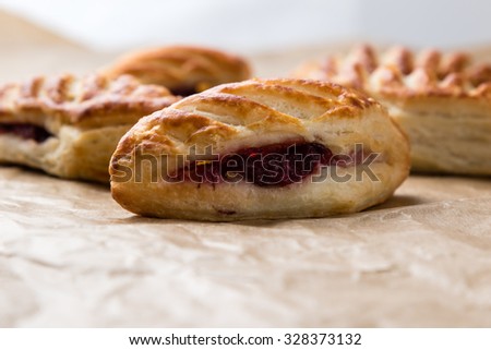 fresh puff pastry with jam on baking paper
