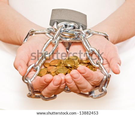 Saving money concept - woman hands with golden coins, chained and locked