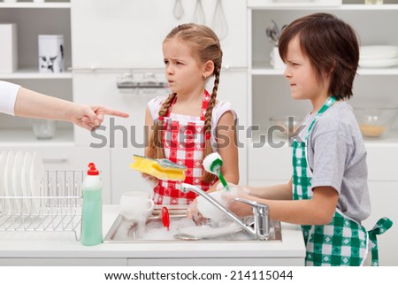 Grumpy kids ordered to do the dishes - by a parent pointed finger