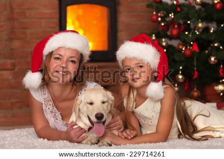 Christmas with our doggy - woman and little girl and the family pet