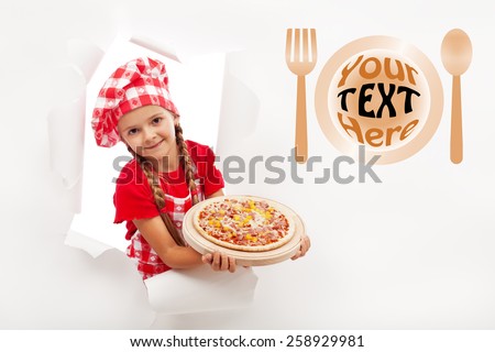 Little chef offering you a fresh pizza - leaning out from a hole in billboard, copyspace
