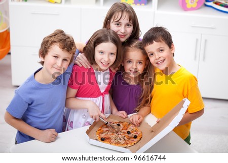 Kids at home preparing to eat pizza
