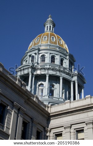 Golden dome of the Colorado state capitol in Denver on a sunny summer morning.  The dome was renovated and restored in 2014.