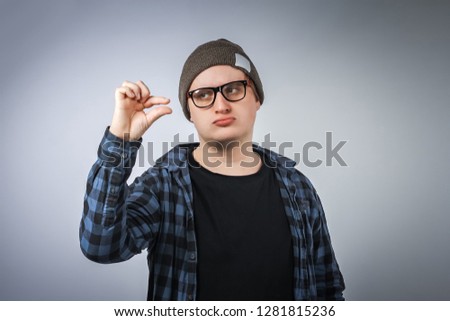 stock-photo-young-man-hipster-holding-something-small-in-his-hands-and-smiling-1281815236.jpg