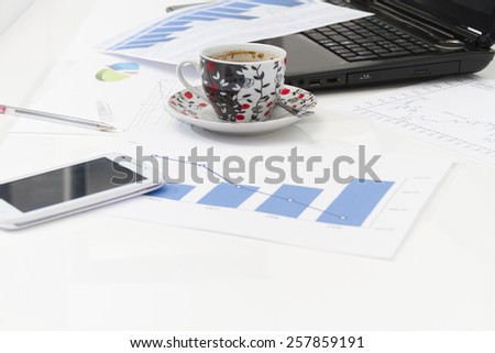 Businessman  with coffee and laptop analyzing of the  monitoring profit dynamics in the company