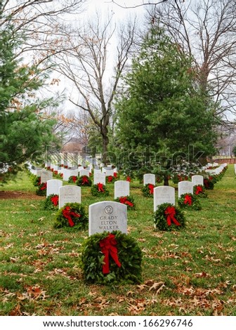ARLINGTON, VA - DECEMBER 16:  Holiday wreaths adorn the headstones of the grave sites of American fallen soldiers as seen on December 16, 2012 at Arlington National Cemetery in Virginia.
