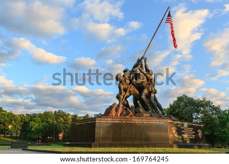 ARLINGTON, VIRGINIA - MARCH 21, 2013:  The Marine Corp War statue illustrates six men who raised the second flag at Iwo Jima battle, and is designed by Felix de Weldon based on Joe Rosenthal\'s photo.