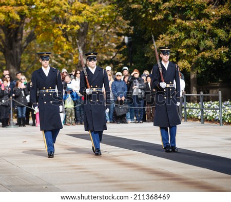 ARLINGTON, VA - NOVEMBER 18, 2012:  The Changing of the Guard is an event that occurs hourly at the Arlington National Cemetery near Washington DC that draws tourists and spectators every day.