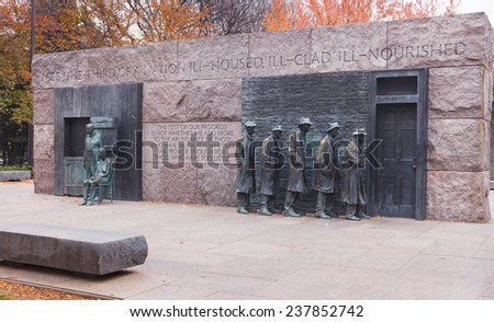 WASHINGTON, DC - NOVEMBER 16, 2014:  The Depression Breadline sculpture and Appalachian couple on the National Mall in autumn are major tourist attractions.