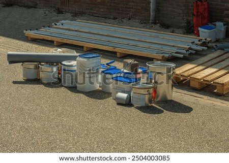 Image, Stock Photo Closed metal can placed on two colored plates on table