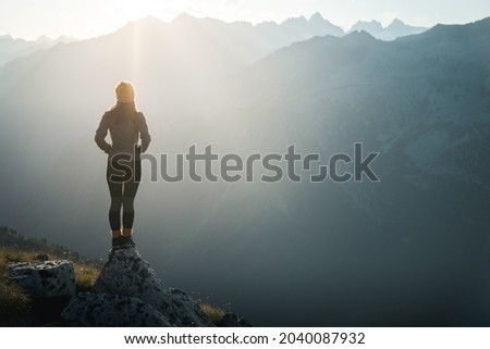 Similar – Image, Stock Photo Female standing on cliff and contemplating