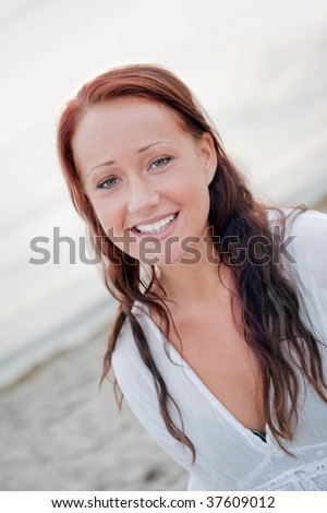portrait of a beautiful young woman with big smile