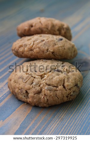 Oatmeal cookie. Three oatmeal cookies with sunflower seeds overlap. Perfect for a day trip, party, meeting over coffee.